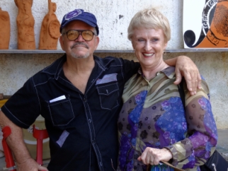 Judy Bongiorno, luxury travel expert, and artist Fuster in front of his art work in Fusterlandia, Cuba