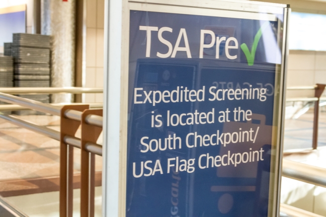 TSA Pre Check in Expedited Screening sign at airport