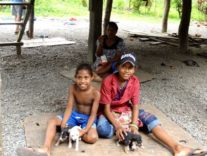 kids and puppies in Papua New Guinea, found on one of our exotic luxury travel adventures